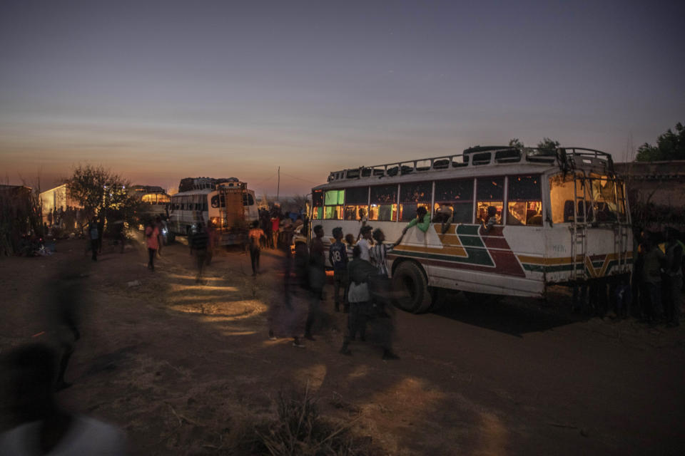 Tigray people who fled the conflict in Ethiopia's Tigray region, arrive on a bus at Umm Rakouba refugee camp in Qadarif, eastern Sudan, Thursday, Nov. 26, 2020. Ethiopia's prime minister said Thursday the army has been ordered to move on the embattled Tigray regional capital after his 72-hour ultimatum ended for Tigray leaders to surrender, and he warned the city's half-million residents to stay indoors and disarm. (AP Photo/Nariman El-Mofty)