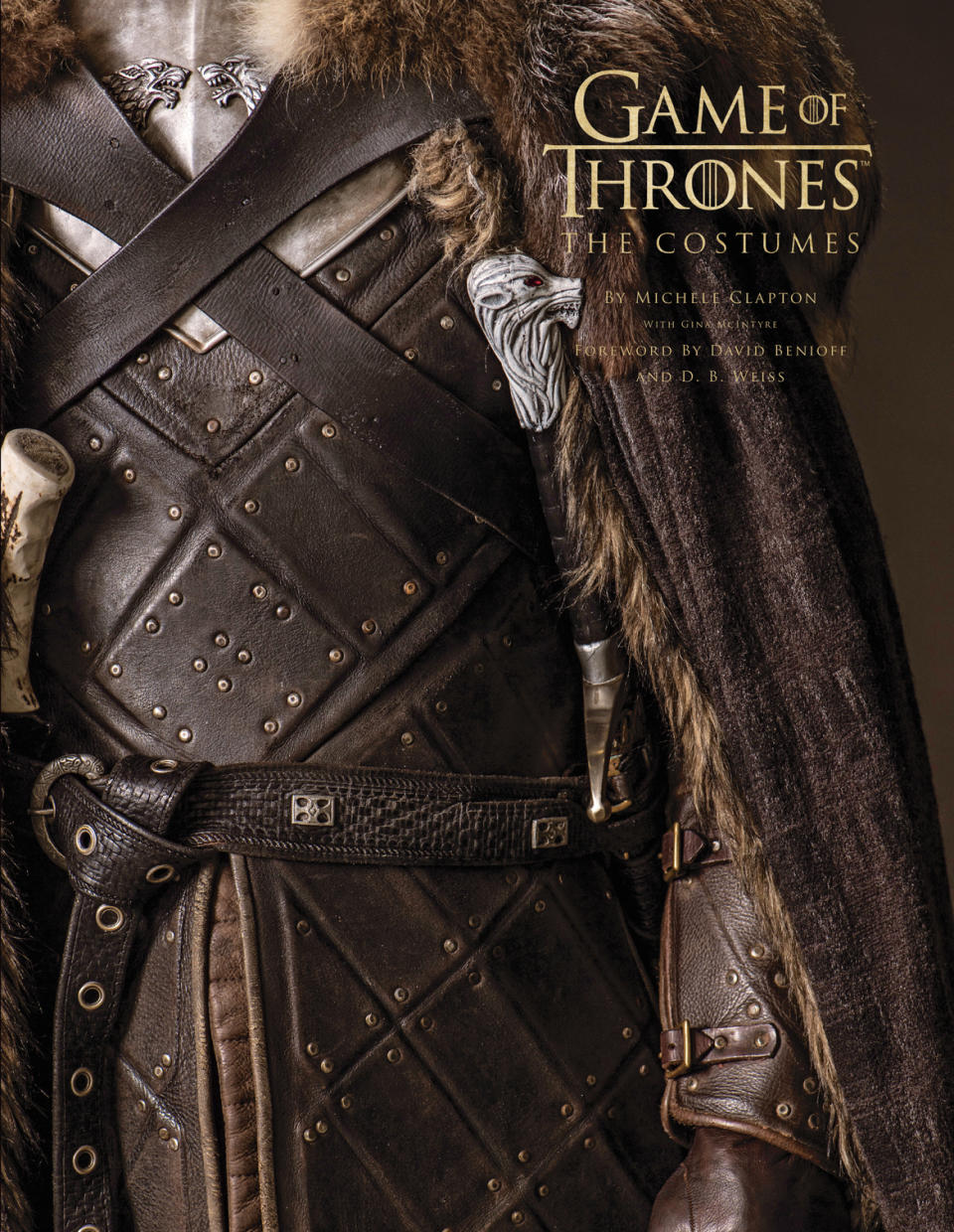 This cover image released by Insight Editions shows “Game of Thrones: The Costumes,” with costumes by Michele Clapton and written by Gina McIntyre. (Insight Editions via AP)