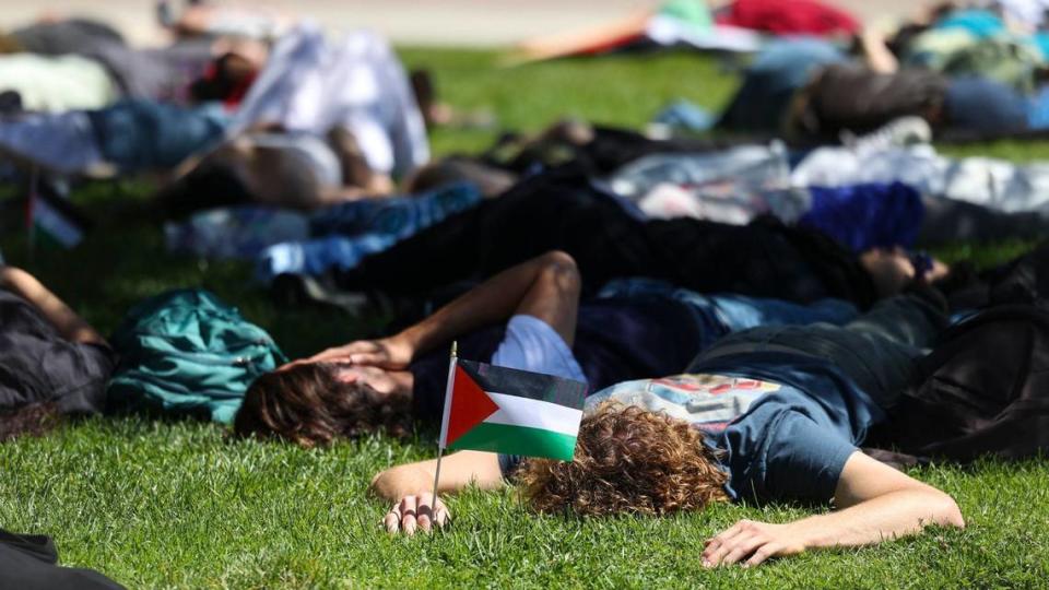 About 70 people gathered on Cal Poly’s Dexter Lawn on May 1, 2024, to stage a silent die-in in support of Palestine. David Middlecamp/dmiddlecamp@thetribunenews.com