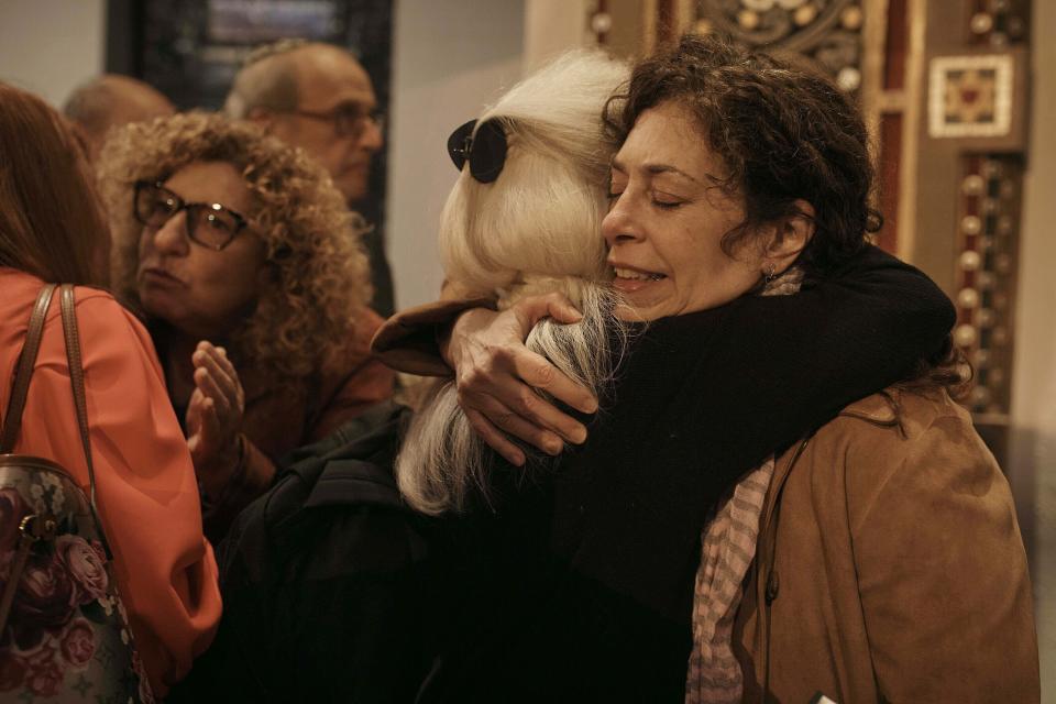 Jews hug after a communal prayer to honor and offer support for the victims in Israel at B'nai Jeshurun Synagogue on Thursday, Oct. 12, 2023, in New York. (AP Photo/Andres Kudacki)