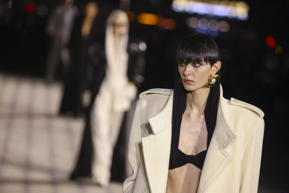 A model wears a creation for the Saint Laurent Spring/Summer 2023 fashion collection presented Tuesday, Sept. 27, 2022 in Paris. (Photo by Vianney Le Caer/Invision/AP)