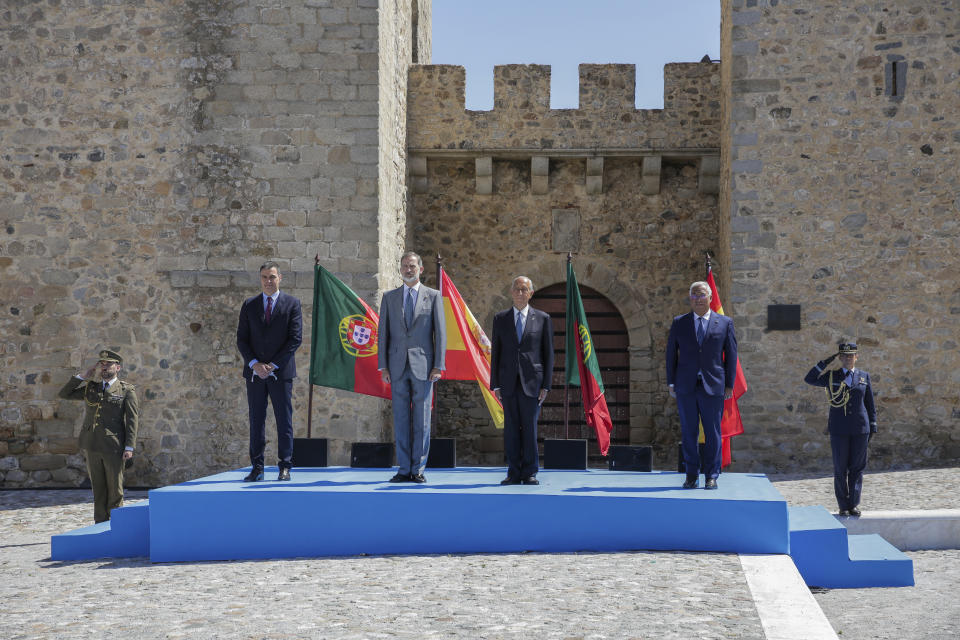 From left to right: Spain's Prime Minister Pedro Sanchez, Spain's King Felipe VI, Portugal's President Marcelo Rebelo de Sousa and Portugal's Prime Minister Antonio Costa stand for national anthems during a ceremony to mark the reopening of the Portugal/Spain border in Elvas, Portugal, Wednesday, July 1, 2020. The border was closed for three and a half months due to the coronavirus pandemic. (AP Photo/Armando Franca)