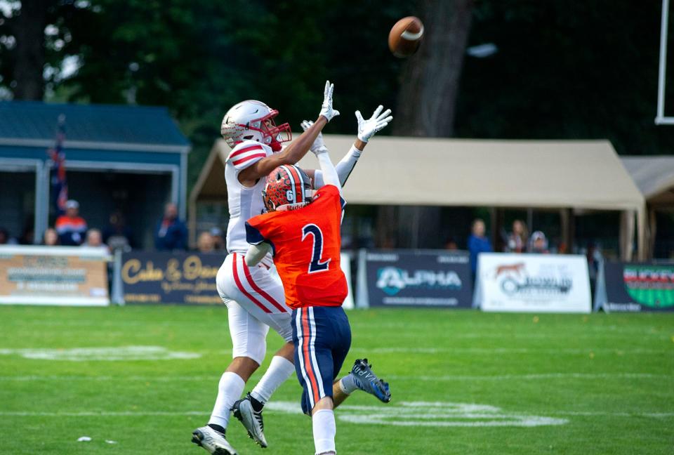 Shelby's Issaiah Ramsey catches the ball ahead of Galion's Elijah Chafin.