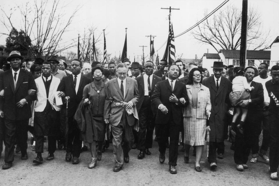 <p>American civil rights campaigner Martin Luther King (1929 - 1968) and his wife Coretta Scott King lead a Black voting rights march from Selma, Alabama, to the state capital in Montgomery. </p>