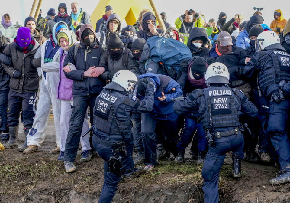 Police officers and protesters clash on a road at the village Luetzerath near Erkelenz, Germany, January 10, 2023. / Credit: Michael Probst/AP