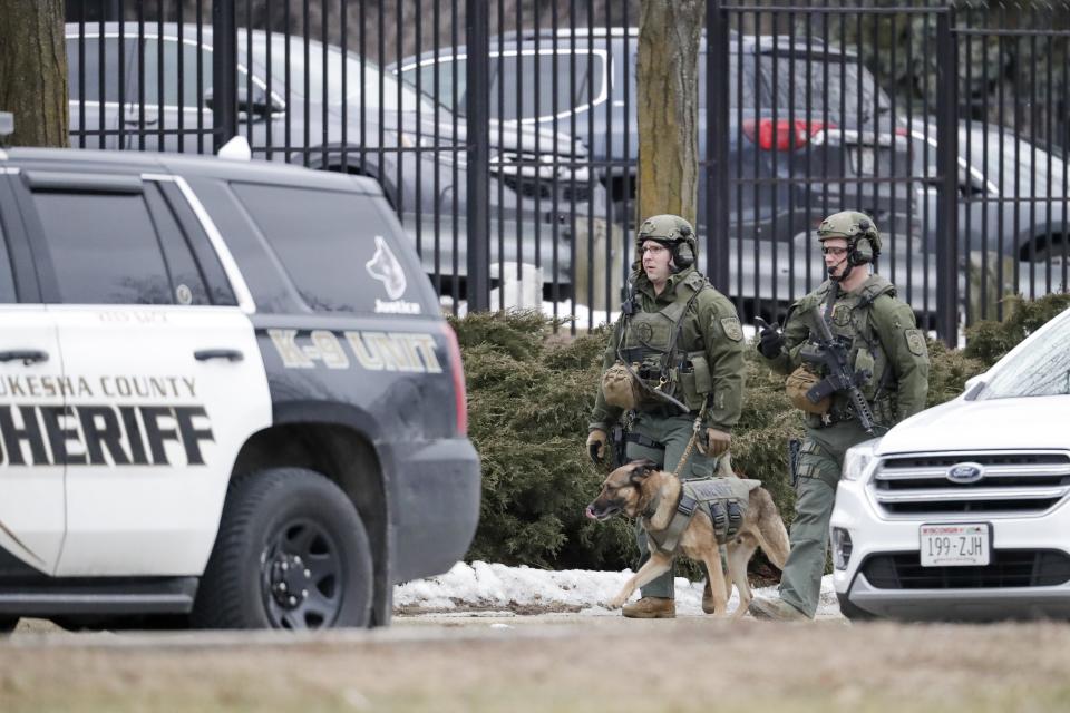 Police conduct searches outside the Molson Coors campus in Milwaukee on Wednesday after reports of a possible shooting. (Photo: Morry Gash/ASSOCIATED PRESS)