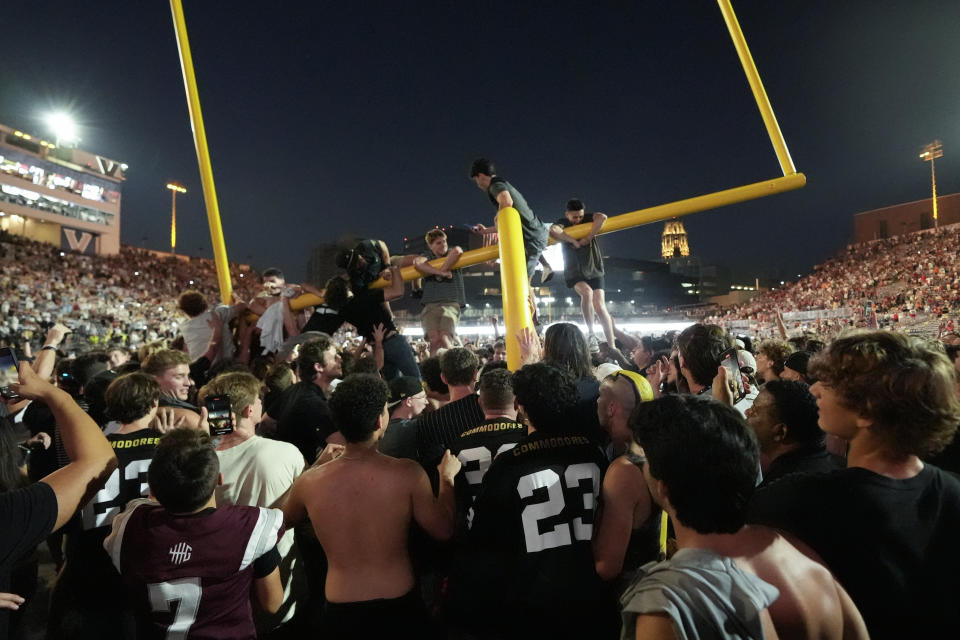 Vanderbilt fans tear down the goal post the after team's 40-35 win over No. 1 Alabama. (AP Photo/George Walker IV)