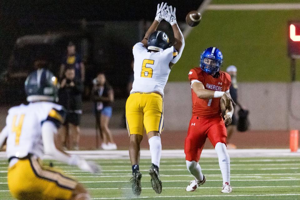 Eastwood’s Jayden Serrano attempts to block Americas’ Mark Moore III (1) pass at a high school football game on Friday, Oct. 6, 2023, at the SISD Student Activities Complex in El Paso.