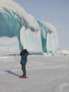 The giant waves covered in a brilliant blue sheen are actually giant icicles, <a href="http://www.snopes.com/photos/natural/antarcticwave.asp" rel="nofollow noopener" target="_blank" data-ylk="slk:according to rumor-busting website Snopes.com;elm:context_link;itc:0;sec:content-canvas" class="link ">according to rumor-busting website Snopes.com</a>. “The beautiful smoothly polished surfaces are again the result of melting,” it notes. “The transparent ice … has been created in a glacier or ice cap by the slow annealing of ice as it is buried under each year's successive accumulation of snow.” <a href="http://www.astro.caltech.edu/~tonyt/Tonys_site/About_Me.html" rel="nofollow noopener" target="_blank" data-ylk="slk:(Photo by Tony Travouillon);elm:context_link;itc:0;sec:content-canvas" class="link ">(Photo by Tony Travouillon)</a>