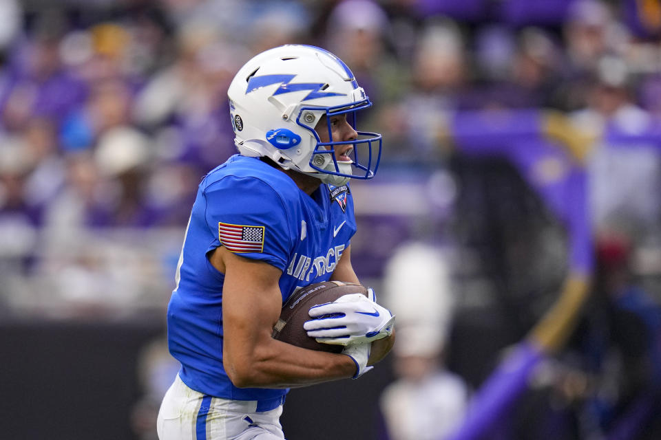 Air Force wide receiver Jared Roznos runs with the ball after making a touchdown catch against James Madison during the first half of the Armed Forces Bowl NCAA college football game, Saturday, Dec. 23, 2023, in Fort Worth, Texas. (AP Photo/Julio Cortez)