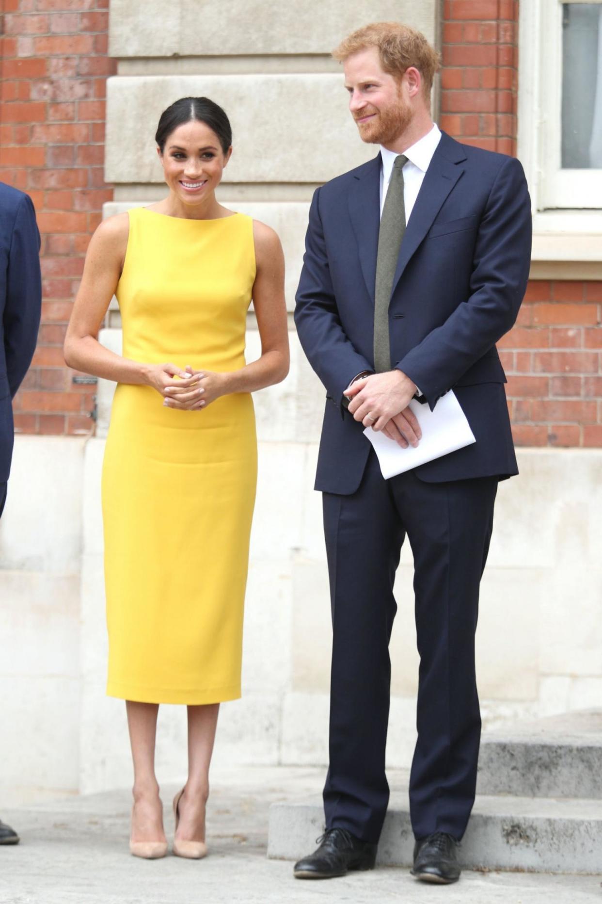 Meghan Markle dazzles in yellow as she joins Prince Harry at the “Your Commonwealth” youth reception in London. (Photo: AP Images)