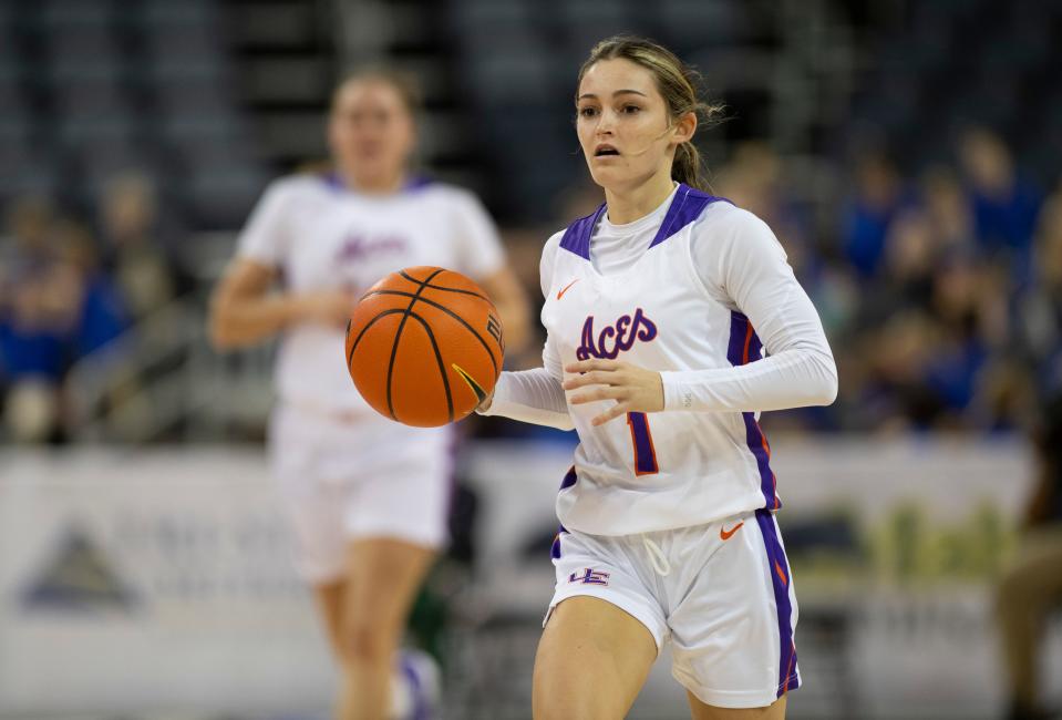 Evansville’s Anna Newman (1) dribbles the ball as the University of Evansville Purple Aces play the Chicago State Cougars at Ford Center in Downtown Evansville, Ind., Wednesday afternoon, Nov. 16, 2022. 