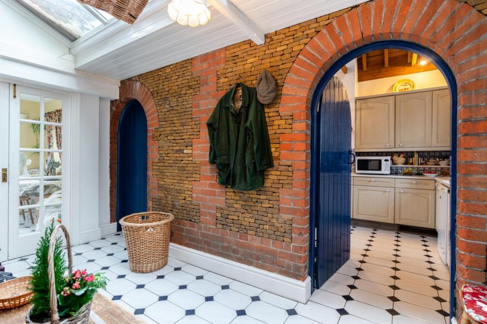 A characterful garden room has two sets of french doors opening out to the terrace, plus a roof lantern which floods the space with natural light (Sowerbys Estate Agents/Kristian Lehner)