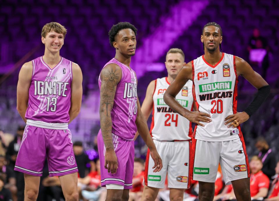 Matas Buzelis (13) and Ron Holland (0) of G League Ignite stand next to the Perth Wildcats' Alex Sarr (20) during the second half of an NBA G League Fall Invitational game Sept. 8, 2023 in Henderson, Nevada.