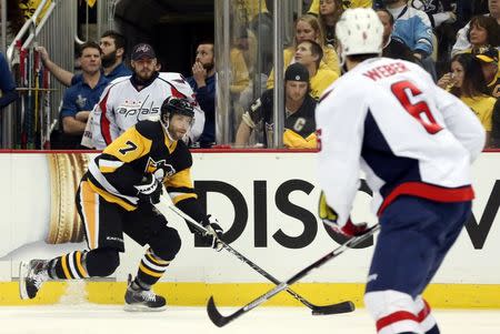 May 4, 2016; Pittsburgh, PA, USA; Pittsburgh Penguins center Matt Cullen (7) carries the puck as Washington Capitals defenseman Mike Weber (6) defends during the first period in game four of the second round of the 2016 Stanley Cup Playoffs at the CONSOL Energy Center. Mandatory Credit: Charles LeClaire-USA TODAY Sports