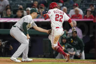 Los Angeles Angels' David Fletcher (22) is tagged out by Oakland Athletics first baseman Matt Olson during the seventh inning of a baseball game Friday, Sept. 17, 2021, in Anaheim, Calif. (AP Photo/Ashley Landis)