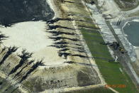 <p>In this September 19, 2018, photo released by Cape Fear River Watch, heavy rains from Hurricane Florence erode and breach a coal ash landfill at the L.V. Sutton Power Station in Wilmington, N.C. The landfill under construction at the site ruptured over the weekend, spilling enough material to fill 180 dump trucks. Coal ash contains arsenic, mercury and other toxic metals.(Kemp Burdette/Cape Fear River Watch via AP) </p>