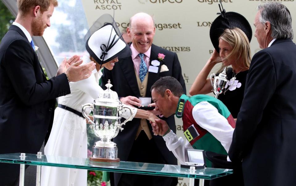 Frankie Dettori is presented with the trophy for the St James's Palace Stakes (PA)