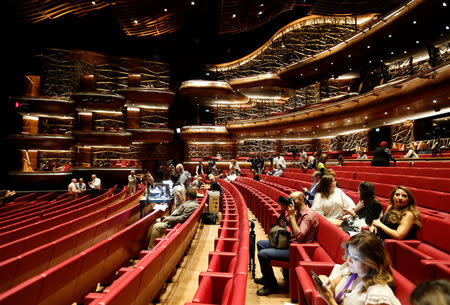 People are seen before the start of the dress rehearsal for the Barber of Seville ahead of the opening of the first Dubai Opera house, the UAE August 30, 2016. REUTERS/Ahmed Jadallah