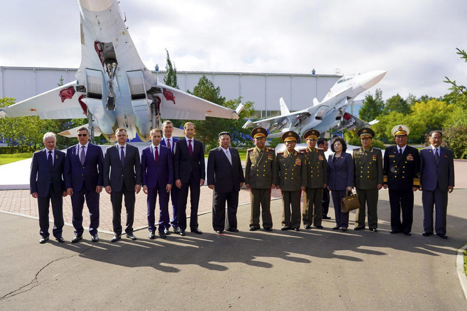 In this photo released by the governor of the Russian far eastern region of Khabarovsky Krai region Mikhail Degtyarev telegram channel, North Korean leader Kim Jong Un, center, poses for a photo after visiting Russian aircraft plant that builds fighter jets in Komsomolsk-on-Amur, about 6,200 kilometers (3,900 miles) east of Moscow, Russia Friday, Sept. 15, 2023. (The governor of the Russian far eastern region of Khabarovsky Krai region Mikhail Degtyarev telegram channel via AP)