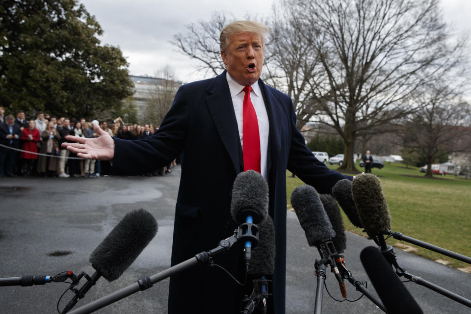 President Donald Trump talks with reporters Friday before boarding Marine One on the South Lawn of the White House. (AP Photo/Evan Vucci)