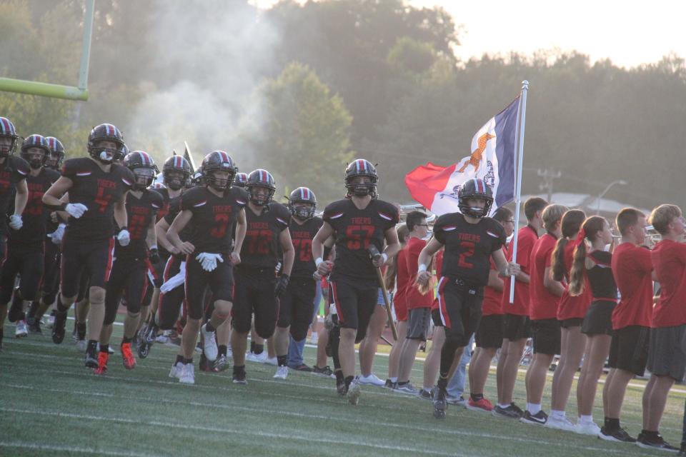 ADM players run onto the field on Friday, Sept. 8, 2023, at Tiger Stadium in Adel.