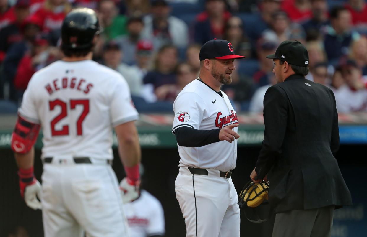 Guardians manager Stephen Vogt seeks clarification from umpire David Rackley during the third inning of the home opener against the Chicago White Sox, Monday, April 8, 2024.