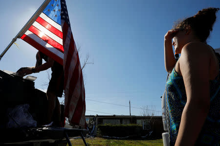 Taylor Fontenot, president of 50 Star Search and Rescue, distributes hot food prepared by Operation BBQ Relief in the aftermath of Hurricane Michael in Springfield, Florida, U.S., October 16, 2018. REUTERS/Brian Snyder