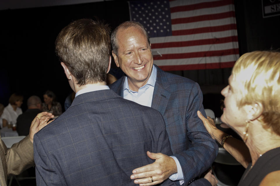 North Carolina 9th district Republican congressional candidate Dan Bishop greets supporters in Monroe, N.C., Tuesday, Sept. 10, 2019. (AP Photo/Nell Redmond)