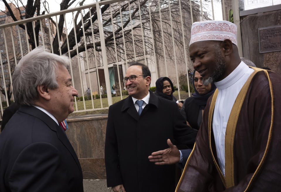 United Nations Secretary General Antonio Guterres, left, is greeted by Sheik Saad Jalloh, imam of the Islamic Cultural Center of New York, as he arrives for a service, Friday, March 22, 2019 in the wake of a white supremacist's deadly shooting spree on two mosques, March 15, in Christchurch, New Zealand. (AP Photo/Mark Lennihan)