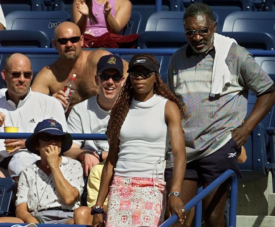 Venus Williams and Richard Williams walk to their seats as Serena competes in the 2001 Indian Wells final.