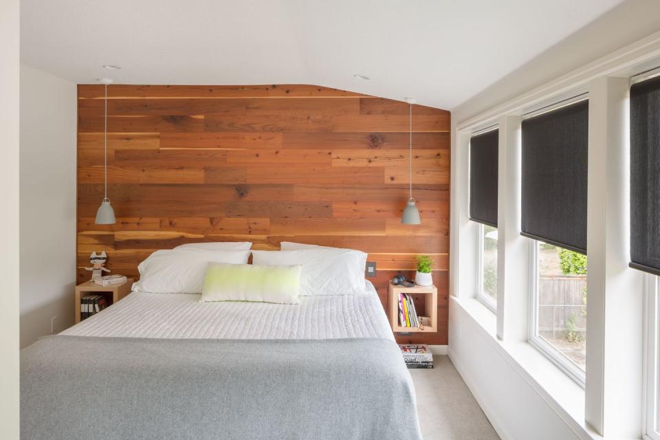 <p>A wood accent wall creates warmth in this space by <a href="https://deringhall.com/interior-designers/guggenheim-architecture-and-design-studio" rel="nofollow noopener" target="_blank" data-ylk="slk:Guggenheim Architecture and Design Studio;elm:context_link;itc:0;sec:content-canvas" class="link ">Guggenheim Architecture and Design Studio</a>.</p>