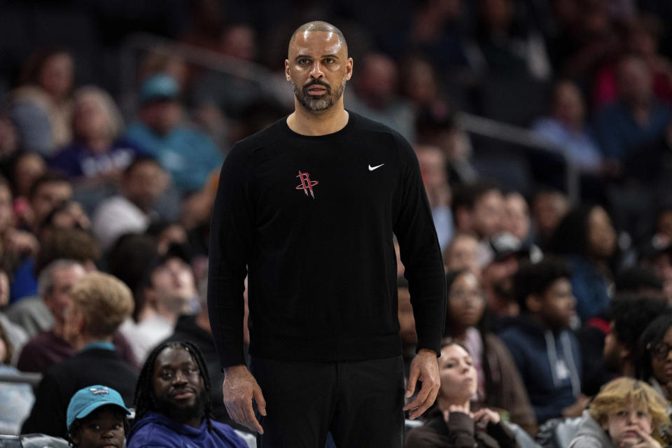Houston Rockets coach Ime Udoka watches during the first half of the team's NBA basketball game against the Charlotte Hornets on Friday, Jan. 26, 2024 in Charlotte, N.C. (AP Photo/Jacob Kupferman)