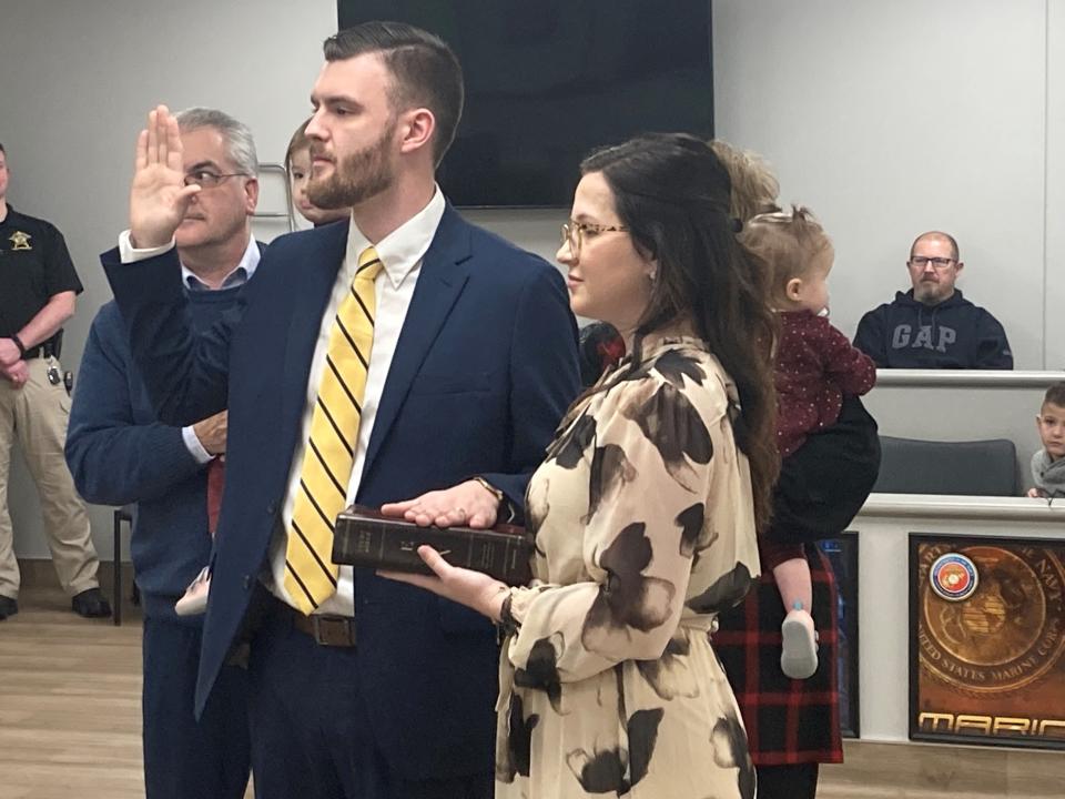 Isaac Miller lays his hand on a Bible held by his wife, Sara, and takes his oath of office in late December. Miller will represent District 4 for the remainder of 2023, filling out the term of Brad Polk, who is now Delaware County Treasurer. He was scratched from the spring GOP primary ballot Friday by the Delaware County Election Board due to a paperwork filing error.