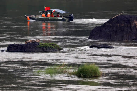 A Chinese boat, with a team of geologists, surveys the Mekong River, at the border between Laos and Thailand April 23, 2017. Picture taken April 23, 2017. REUTERS/Jorge Silva