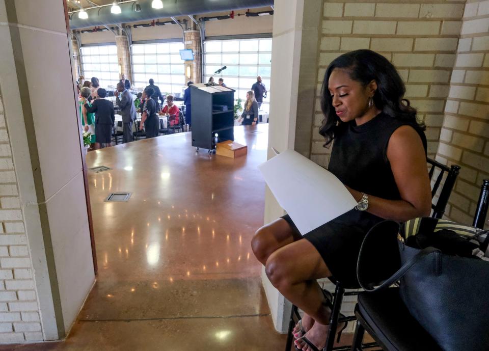 Tamika Alexander, emcee for the Tuscaloosa Civil Rights Foundation Uplift Awards at Tuscaloosa River Market, rehearses her remarks before the event Friday, May 19, 2023.