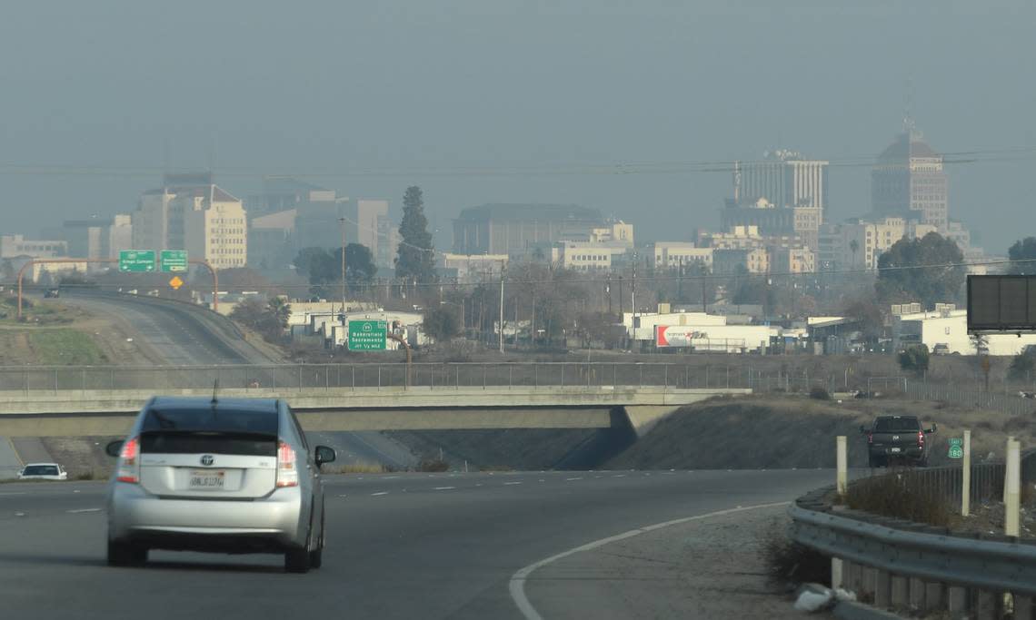 Fresno’s skyline is seen through the haze along the 180 Freeway, Jan. 12, 2021.