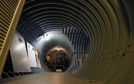 A hallway is shown with a generator at the far end in the cold-war era nuclear fallout shelter constructed for U.S. President John F. Kennedy on Peanut Island near Riviera Beach, Florida November 8, 2013. REUTERS/Joe Skipper