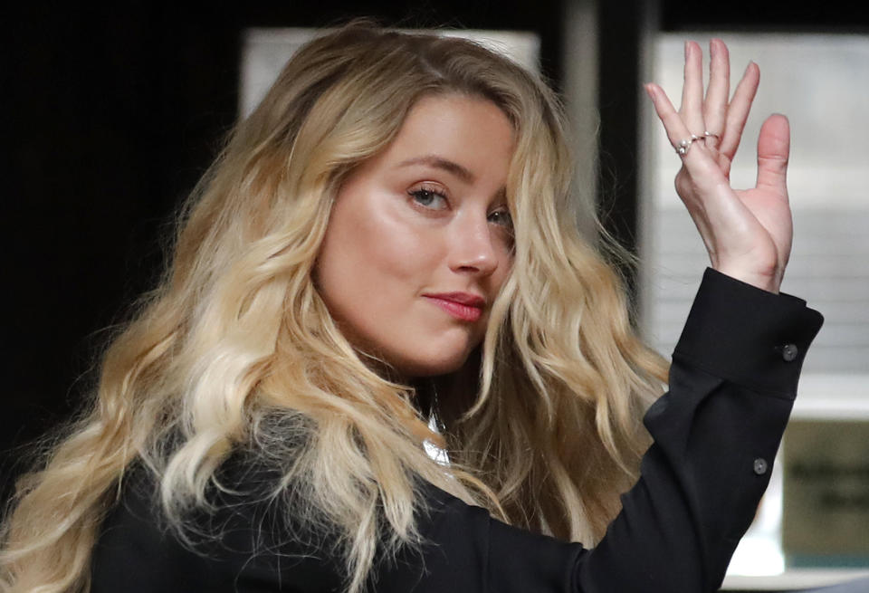 FILE - In this file photo dated Tuesday, July 28, 2020, US Actress Amber Heard, former wife of actor Johnny Depp, arrives at the High Court in London. Britain’s judicial office said Tuesday Oct. 27, 2020, that judge Andrew Nicol will deliver his verdict in writing on Nov. 2, ruling on whether Johnny Depp was libelled by a tabloid newspaper that accused him of assaulting his then wife Amber Heard. (AP Photo/Frank Augstein, FILE)