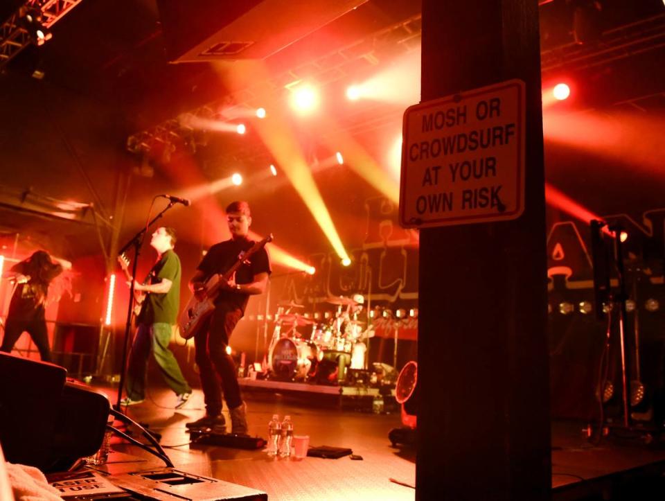 A sign reads “Mosh or crowdsurf at your own risk” at Hot Mulligan’s Why Would I Watch Tour at The Fillmore in Charlotte, N.C., on Tuesday, Nov. 21, 2023.