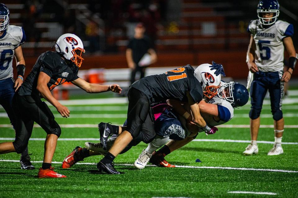 Pawling's Justin Mitchell makes a hard tackle on the ball carrier during an Oct. 6, 2023 football game against Pine Plains/Rhinebeck.