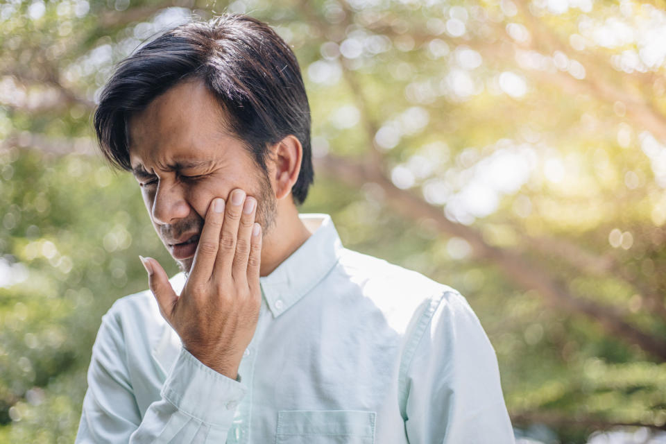 a man experiencing a toothache