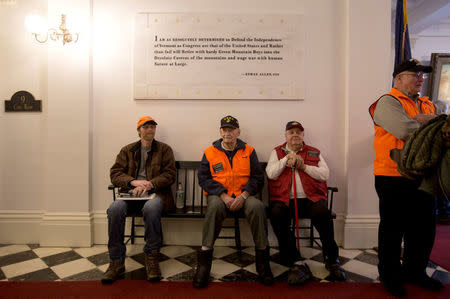 FILE PHOTO: A group of men wait inside the Vermont State Legislature for the annual Sportsmen's Legislative Mixer in Montpelier, Vermont, U.S., March 13, 2018. REUTERS/Christinne Muschi/File Photo