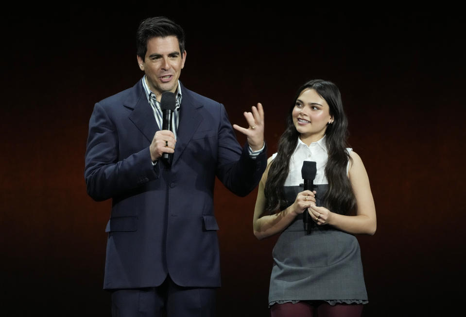 Eli Roth, left, writer/director of "Borderlands," and cast member Ariana Greenblatt discuss the film during the Lionsgate presentation at CinemaCon 2024, Wednesday, April 10, 2024, at Caesars Palace in Las Vegas. (AP Photo/Chris Pizzello)