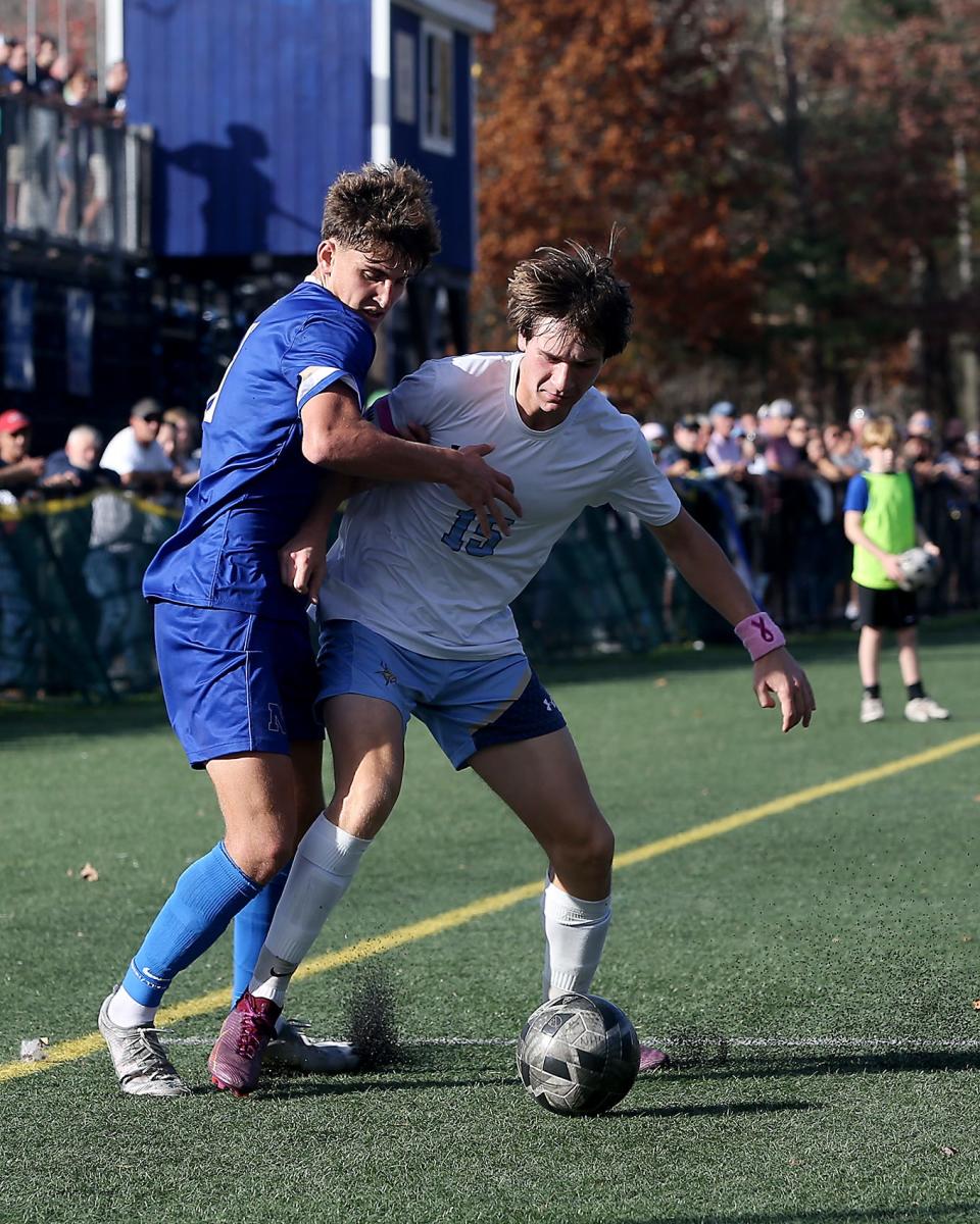 Norwell's Max Flanders and East Bridgewater's Zachary Higgins battle for possession during first half action of their Round of 32 game against East Bridgewater in the Division 3 state tournament at the Norwell Clipper Community Complex on Saturday, Nov. 5, 2022. Norwell would go on to win 3-0.
