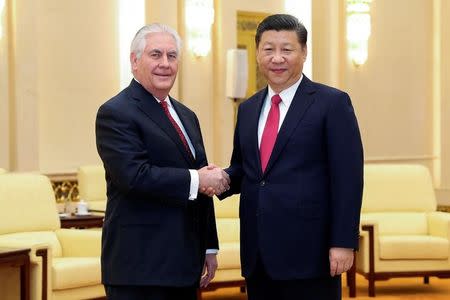 Chinese President Xi Jinping (R) shakes hands with U.S. Secretary of State Rex Tillerson before their meeting at at the Great Hall of the People on March 19, 2017 in Beijing, China. REUTERS/Lintao Zhang/Pool