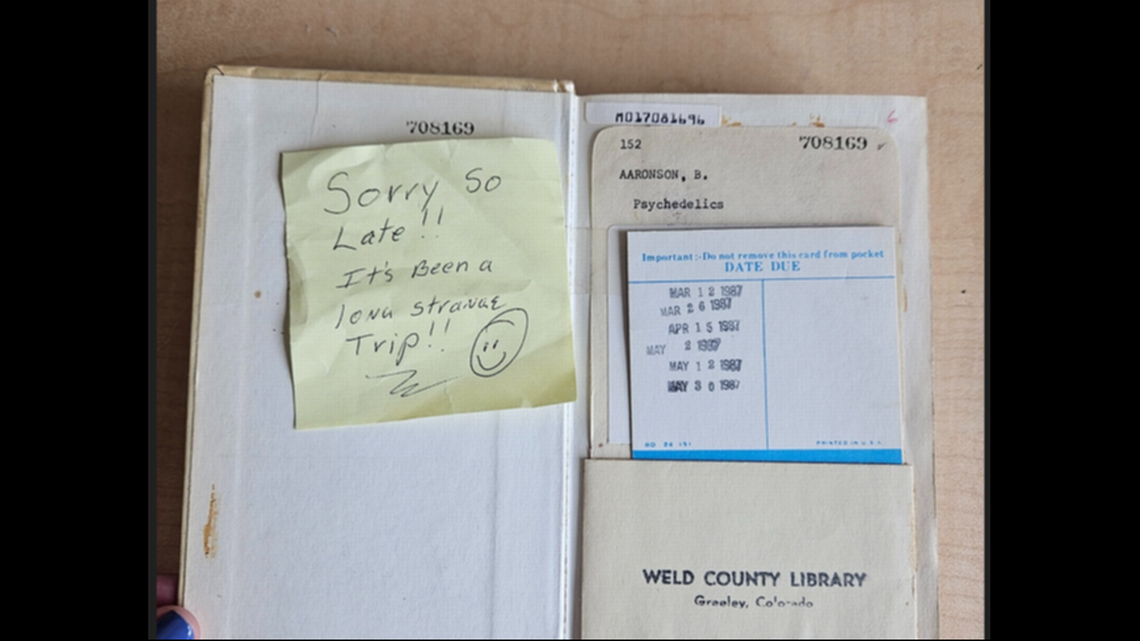 A sticky notes accompanies a nearly 37-year overdue book.