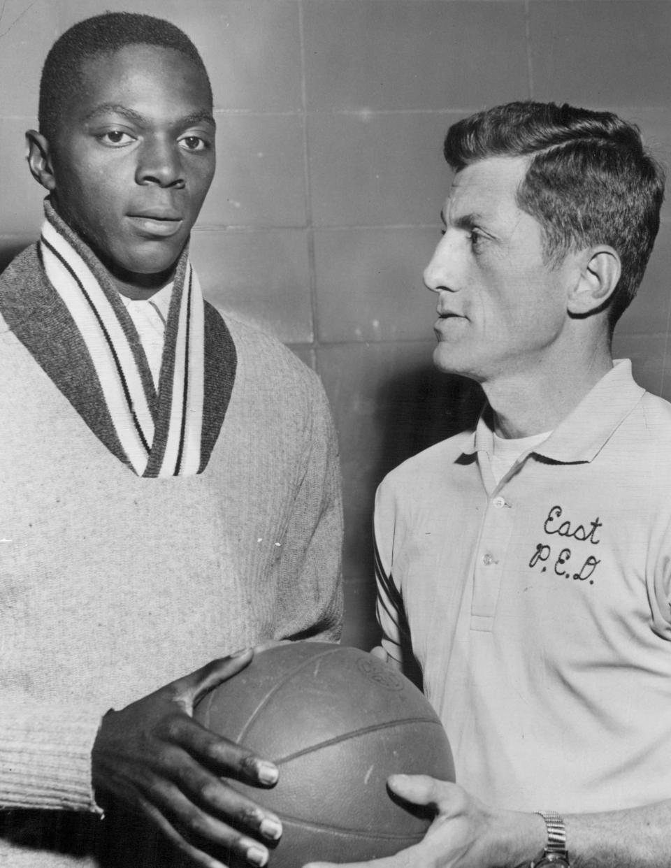 Al Butler, left, a Niagara University basketball star pays a surprise visit to Don Youngman, coach at East High School in Rochester in this late 1950s photo. Butler, a former player at East, is among the best players ever to come out of Section V.