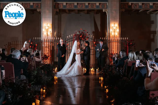 <p>DeAngelo Castro for SYMBOLL</p> Nita Strauss and Josh Villalta exchange vows at their wedding