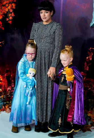 <p>NIKLAS HALLE'N/AFP/Getty</p> Lily Allen and daughters Marnie Rose Cooper and Ethel Cooper pose on the red carpet as they arrive to attend the European premiere of the film "Frozen 2" on November 17, 2019.